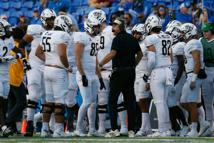 UCF Knights head coach Gus Malzahn talks with his players in a huddle